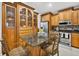 Eat-in kitchen with stainless steel appliances and granite counters. Dark wood cabinets at 9220 Hidden Water Cir, Riverview, FL 33578