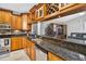 Stylish kitchen with granite counters, stainless steel appliances, and wine storage above at 9220 Hidden Water Cir, Riverview, FL 33578