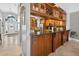 Kitchen features granite countertops, stainless steel appliances, wooden cabinets, and a wine rack at 9220 Hidden Water Cir, Riverview, FL 33578