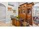 Gourmet kitchen featuring custom cabinetry, island seating, and stone countertops at 9220 Hidden Water Cir, Riverview, FL 33578