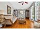 Elegant living room boasts hardwood floors, natural light and tasteful decor at 9220 Hidden Water Cir, Riverview, FL 33578