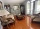 Elegant living room with hardwood floors, large windows, and classic furnishings at 9220 Hidden Water Cir, Riverview, FL 33578