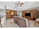 The living room offers ample seating, tile floors, and custom built-in cabinetry at 9220 Hidden Water Cir, Riverview, FL 33578