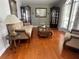 Elegant living room with hardwood floors, display cabinets, and stylish furnishings at 9220 Hidden Water Cir, Riverview, FL 33578