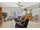 A cozy living room boasts tile floors, vaulted ceilings, and a comfortable reclining sofa at 9220 Hidden Water Cir, Riverview, FL 33578