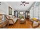 Elegant living room with hardwood floors, neutral walls, and ornate furniture at 9220 Hidden Water Cir, Riverview, FL 33578