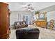 Inviting living room with vaulted ceilings, tile floors, recessed lights, and access to the lanai through sliding glass doors at 9220 Hidden Water Cir, Riverview, FL 33578