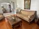 Cozy living room featuring classic furniture, hardwood floors, and a view into the dining area at 9220 Hidden Water Cir, Riverview, FL 33578