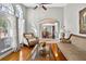 Inviting living room featuring an archway to the dining room, hardwood floors, and elegant furnishings at 9220 Hidden Water Cir, Riverview, FL 33578
