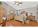 Main bedroom featuring vaulted ceilings and wooden furniture at 9220 Hidden Water Cir, Riverview, FL 33578