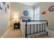 Bedroom featuring neutral paint, carpet and plantation shutters at 10015 Brompton Dr, Tampa, FL 33626