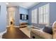 Bright bonus room features hardwood floors, neutral paint, media center and plantation shutters at 10015 Brompton Dr, Tampa, FL 33626