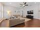 A cozy living room featuring a sectional sofa, modern lighting, and hardwood floors at 10015 Brompton Dr, Tampa, FL 33626