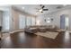 A comfortable living room with recessed lighting, plantation shutters, and crown molding at 10015 Brompton Dr, Tampa, FL 33626