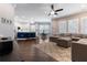 Open-concept living area connecting the kitchen, dining area, and living room with hardwood floors at 10015 Brompton Dr, Tampa, FL 33626