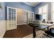 Office area featuring french doors, hardwood flooring, and ample natural light at 10015 Brompton Dr, Tampa, FL 33626