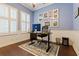 Well-lit office space with hardwood floors, plantation shutters, and stylish decorations at 10015 Brompton Dr, Tampa, FL 33626
