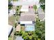 Aerial view of a single-Gathering home with a screened-in pool and boat on property at 11996 117Th St, Seminole, FL 33778