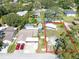 Aerial view of a property with a boat and two cars parked outside at 11996 117Th St, Seminole, FL 33778