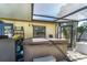An outdoor spa and covered patio with a fan provides a shaded area for relaxation and entertainment at 11996 117Th St, Seminole, FL 33778
