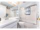 Neat bathroom offers a shower-tub combo, vanity sink, and all-white decor at 11996 117Th St, Seminole, FL 33778