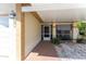 Inviting home entrance with tiled walkway, a covered porch, and a screen door, creating a welcoming first impression at 11996 117Th St, Seminole, FL 33778
