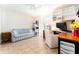 Well-organized home office with a comfortable seating area and natural light at 11996 117Th St, Seminole, FL 33778