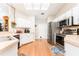 Well-lit kitchen features stainless steel appliances, hardwood floors, and white cabinetry at 11996 117Th St, Seminole, FL 33778