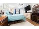 Spacious bedroom boasts a large bed, wood flooring, and ample storage at 11996 117Th St, Seminole, FL 33778