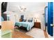 Comfortable bedroom includes a queen-sized bed, ceiling fan, and natural light at 11996 117Th St, Seminole, FL 33778