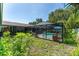 A beautiful caged pool, surrounded by lush greenery, promising a private and serene outdoor retreat at 11996 117Th St, Seminole, FL 33778