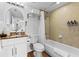 Bathroom with a vanity, shower, and tub at 12000 Gulf Blvd # 506N, Treasure Island, FL 33706