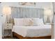 Stylish bedroom with wooden floors and beach-themed accents at 12000 Gulf Blvd # 506N, Treasure Island, FL 33706