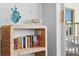 Bookshelf with decorations, and patio doors to the balcony at 12000 Gulf Blvd # 506N, Treasure Island, FL 33706