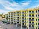 Exterior view of multi-level building featuring multiple levels, private balconies, and on-site parking at 12000 Gulf Blvd # 506N, Treasure Island, FL 33706