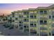 Multi-story building exterior featuring multiple levels, private balconies, on-site parking, and convenient beach access at 12000 Gulf Blvd # 506N, Treasure Island, FL 33706