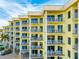 Balconies adorn a multi-story building with outdoor seating, offering scenic views and modern comfort at 12000 Gulf Blvd # 506N, Treasure Island, FL 33706