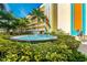 Water fountain set amidst lush green foliage and palm trees at 12000 Gulf Blvd # 506N, Treasure Island, FL 33706