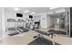 Well-lit fitness center with treadmills, elliptical machines, and a weight bench at 12000 Gulf Blvd # 506N, Treasure Island, FL 33706