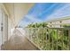 Hallway with an exterior view with palm trees and a view of the building at 12000 Gulf Blvd # 506N, Treasure Island, FL 33706