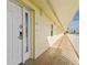 Hallway to the property door with a window and a view of blue skies at 12000 Gulf Blvd # 506N, Treasure Island, FL 33706