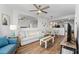Cozy living room with hardwood floors, a sofa, and dining area, creating a welcoming atmosphere at 12000 Gulf Blvd # 506N, Treasure Island, FL 33706
