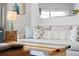 Bright living room showcases a neutral sofa with pillows and a decorative side table with lamp at 12000 Gulf Blvd # 506N, Treasure Island, FL 33706
