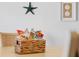 Close-up on a woven basket filled with snacks on a table, under a sea star wall decoration at 12000 Gulf Blvd # 506N, Treasure Island, FL 33706