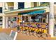 Outdoor tiki bar with seating and a colorful mural, offering a relaxed and social atmosphere at 12000 Gulf Blvd # 506N, Treasure Island, FL 33706