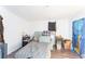 The bedroom features new laminate floors and bright walls at 12037 1/2 Murray Ave, Seminole, FL 33778
