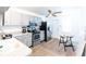 Renovated kitchen features modern appliances, new cabinetry, and countertop at 12037 1/2 Murray Ave, Seminole, FL 33778