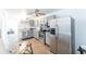 Renovated kitchen features stainless steel appliances, and stylish new cabinetry at 12037 1/2 Murray Ave, Seminole, FL 33778