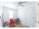 Empty room with painted walls and floors, a ceiling fan, and a window at 12037 1/2 Murray Ave, Seminole, FL 33778