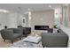 Comfortable living room with an electric fireplace, modern decor, light wood floors, and neutral paint at 12092 97Th Ave, Seminole, FL 33772